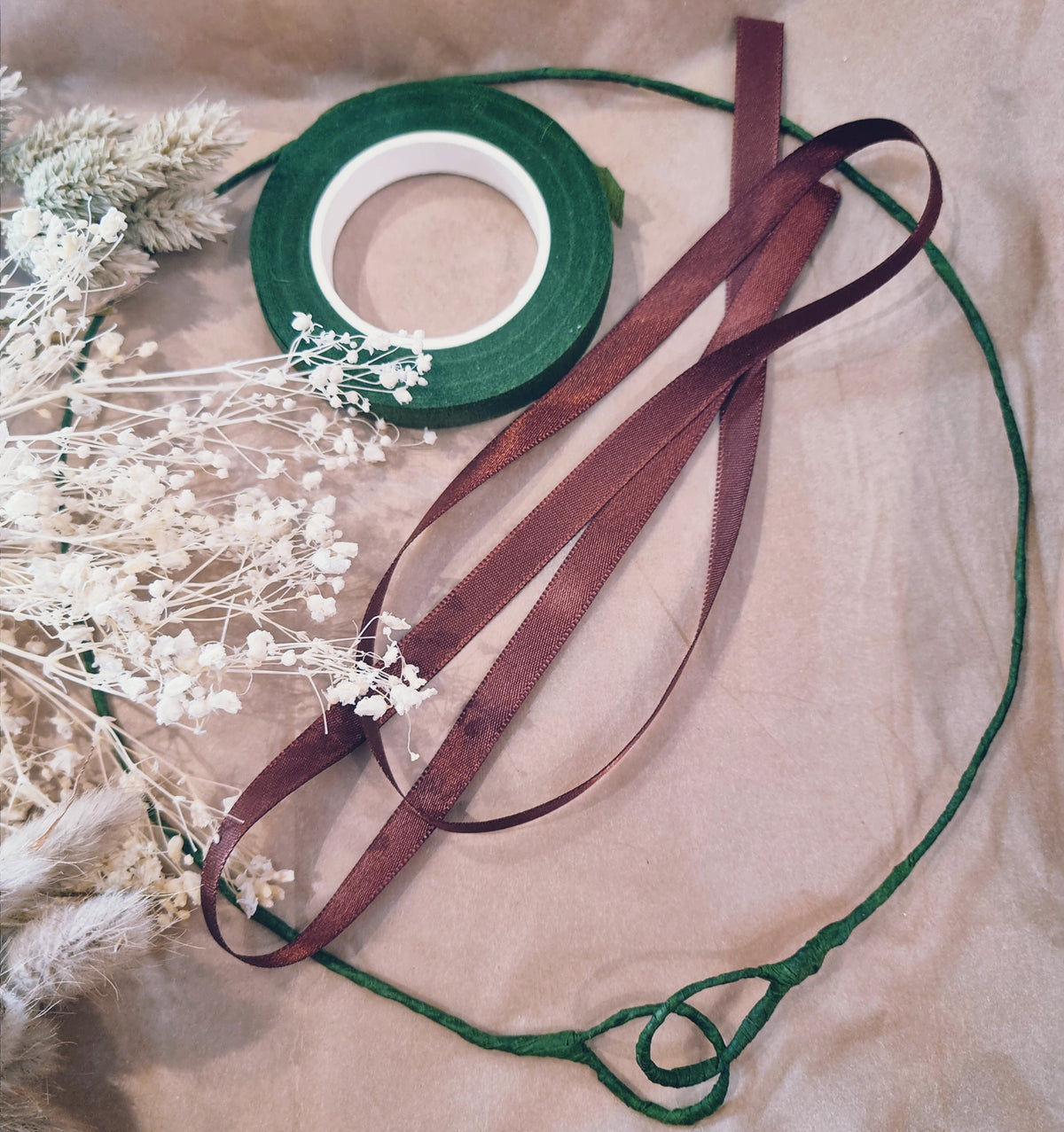 An image of the crown base and floral tape used for the DIY dried flower crown kits.