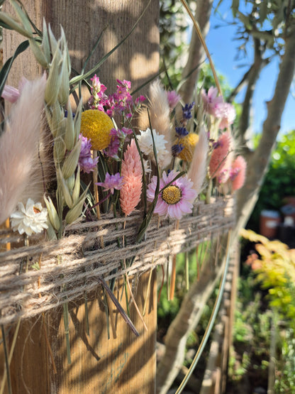 Dried flower hoop portraying a summer meadow of flowers